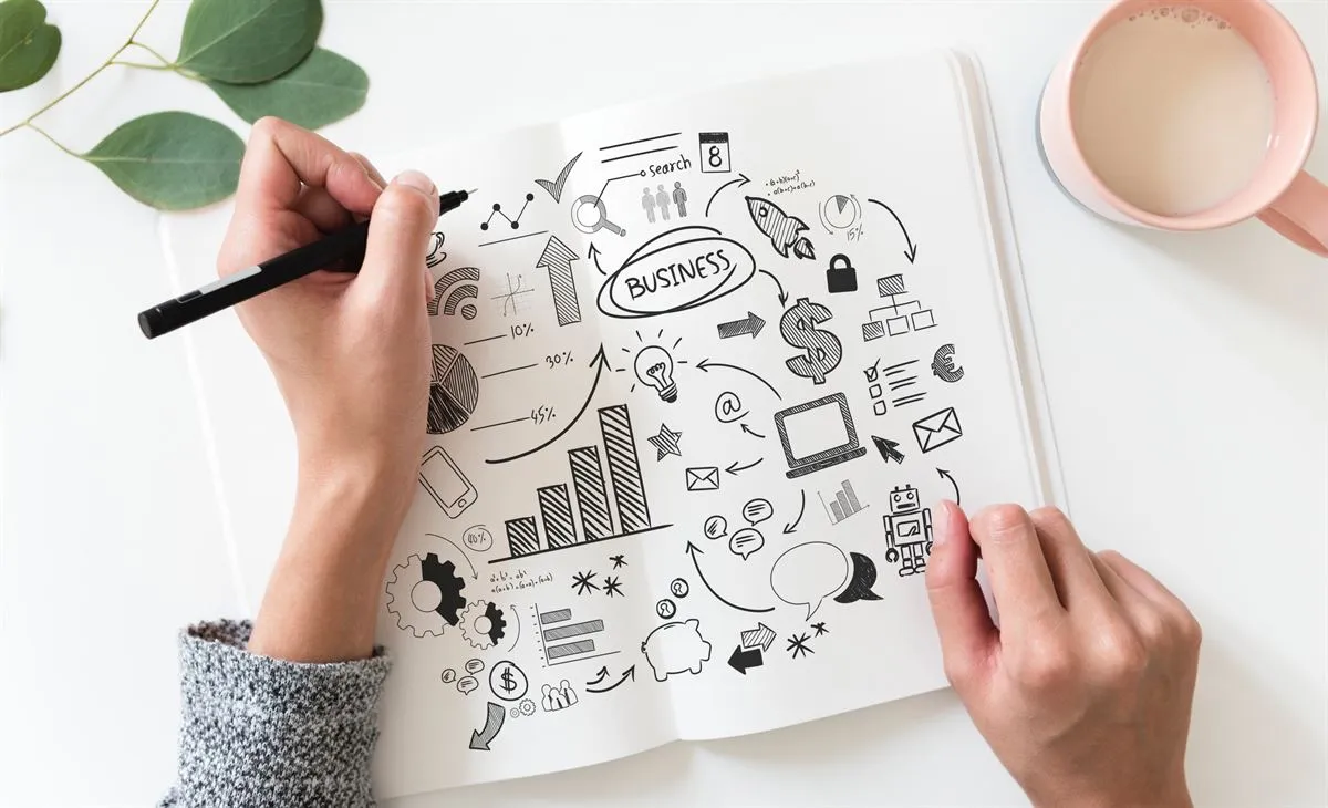 Business owner writing a business plan at a desk